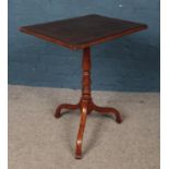 A mahogany tripod wine table with rectangular top. Possible altered top.