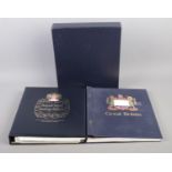 Two hingeless Great British stamp albums, including Stanley Gibbons example (empty).