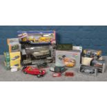 A collection of die cast vehicles. To include Siku Ford Cargo with helicopter 3719 (boxed), Atlas