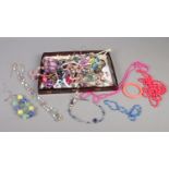 A quantity of costume jewellery. To include necklaces, bangles, beads etc