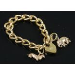 A Gold plated bracelet with two hallmarked 9ct gold charms. Charms assayed in Birmingham in 1976 &
