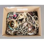 A large box containing mainly beaded costume jewellery. To include necklaces, bangles etc.
