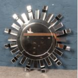 A modern sunburst wall mirror. (80cm x 80cm)