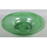 A large green art glass bowl. Diameter 49cm.