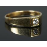 An 18ct Gold Diamond solitaire ring. Size R. Total weight: 3.82g. Diamond 1/8 ct.