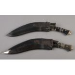 Two Kukri knives in scabbards. 46cm length.