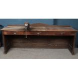 An early 20th century Mahogany shop counter. With paneling detailing & three drawers. (213cm