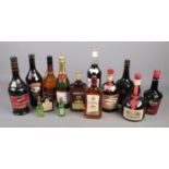 A collection of full and sealed bottles of alcohol. Includes Tia Maria, Pimms, Amaretto etc.