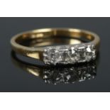 An 18ct Gold and 3 stone old cut diamond ring. Size MÂ½. Total weight: 2.50g.