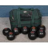 A set of eight Commander crown green bowls, in carry case.