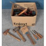 A box of assorted vintage hand tools.