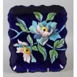 A French Longwy blue ground rectangular dish. Painted with glaze and enamel in floral design. No