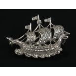 A silver marcasite brooch in the form of a viking ship.