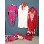 Four ceremonial outfits. To include dress, shoes, costume Jewellery etc