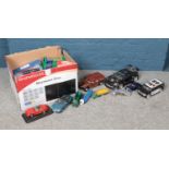 A box of assorted die-cast and battery powered vehicles. To include a Motor Max BMW Z4, Burago