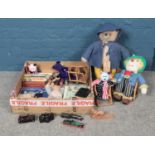 A large box of miscellaneous toys, to include annuals, die cast vehicles and vintage Paddington Bear