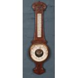 An Oak carved banjo Barometer. No makers name just patent no 16536. H: 85cm W:25cm.