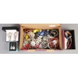 A box of assorted costume/fashion jewellery; mainly earrings, watches and bangles etc.