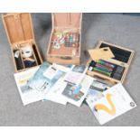 A collection of artist equipment. Includes Winsor & Newton box, sketch pads, watercolours etc.