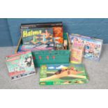 A crate of assorted games to include Monopoly (unopened), Table Football, Meccano etc.