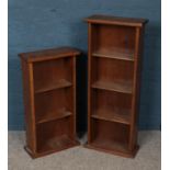 Two oak open bookcases.