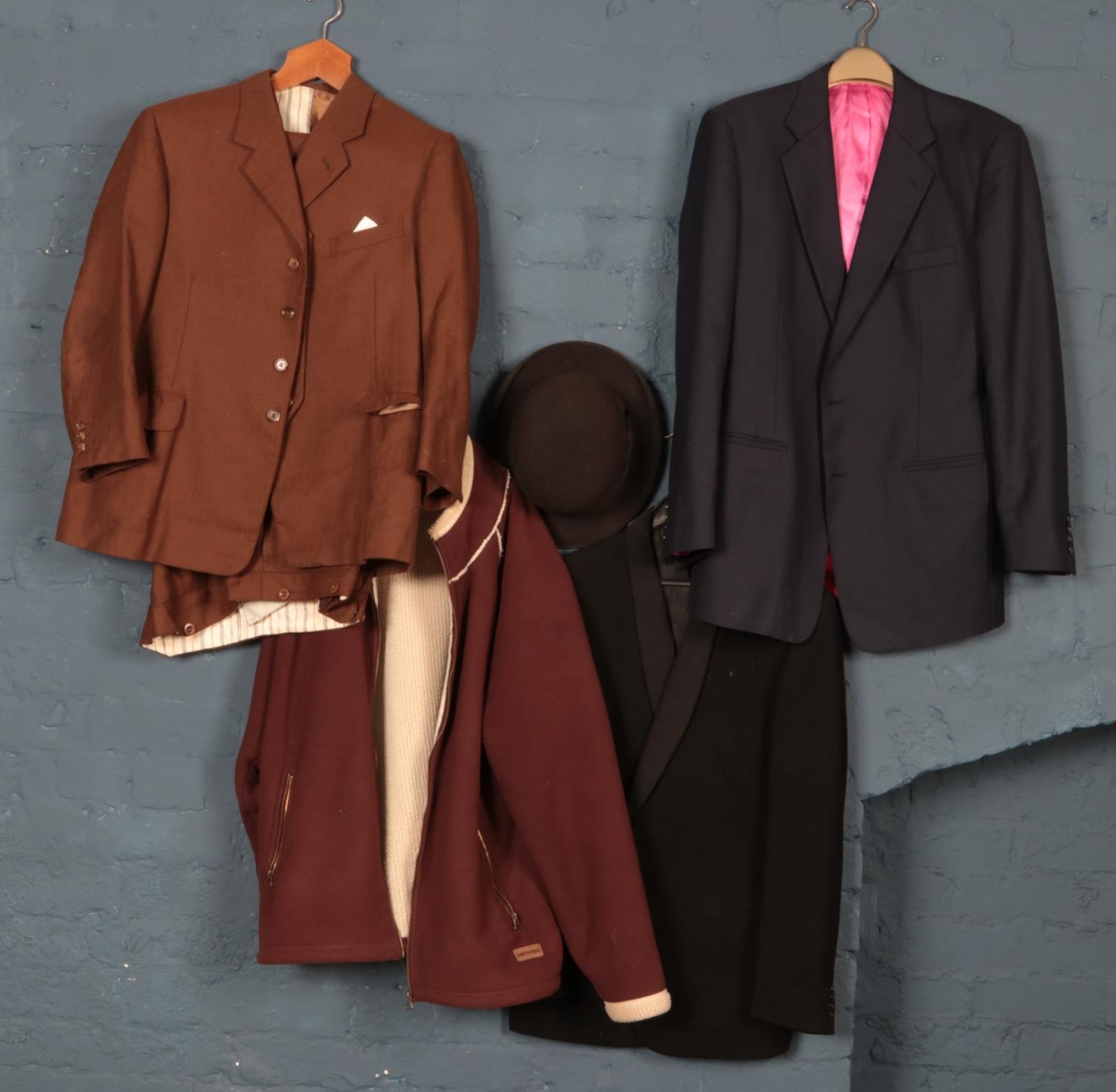 A collection of gents clothing. Includes three piece suit, bowler hat etc.