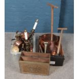 Two boxes of metalwares. Includes copper kettles, possers, brassbound magazine rack, irons etc.