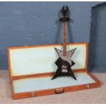 A heavy metal style electric guitar in wooden case.