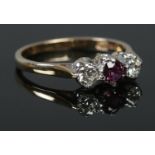A 9ct Gold Ruby and Diamond three stone ring. Size O. Total weight: 2.25g.
