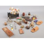 A box of collectables. Including cast iron trick pony money box, miniature tortoise shell mandolins,