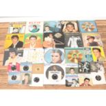 A large collection of Elvis single and album vinyl records, to include Greatest Hits, Elvis Gold,