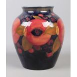 A mid-twentieth century Moorcroft 'Pomegranate' vase, decorated with pomegranates, grapes and leaves