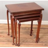 A nest of three mahogany table. Largest table being a fold over card table.