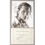 An autograph monochrome photograph of River Phoenix with certificate of authenticity.