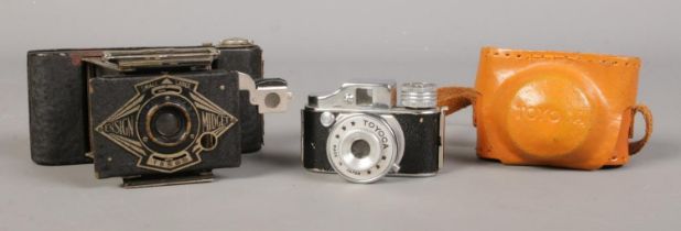 Two miniature cameras, one in case. Ensign Midget and Toyoca.