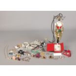 A collection of costume jewellery, to include necklaces, brooches, ring holder etc.