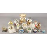 A quantity of snow globes. Including Disney Beauty and the Beast, Beatrix Potter, large carousel