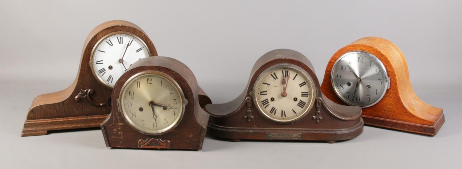 Four wooden cased mantel clocks.