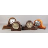 Four wooden cased mantel clocks.