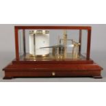 A Russell of Norwich barograph. Fitted in mahogany and glass case with single drawer.