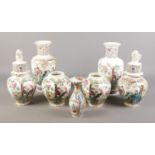 A collection of oriental ceramics, to include examples depicting figures and lidded topped with