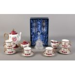 A pair of Diamante champagne glasses, with Rotherham crest, together with an oriental tea set,
