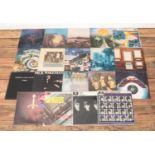 A collection of Rock Vinyl album records, to include The Beatles, The Moody Blues and Rick Wakeman.