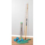 A collection of sporting equipment. Includes Marco fishing rod, weights and tension bar.