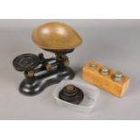 A set of vintage weighing scales and weights.