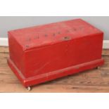 A red painted tool chest. (40cm x 75cm)