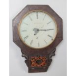 A mahogany cased drop dial wall clock. The dial marked for C Butler.