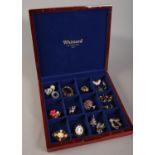 A Whittard of Chelsea display box with contents of costume jewellery brooches.
