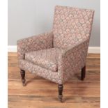 A child's upholstered arm chair raised on turned supports. One caster loose.