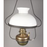 A brass and glass oil ceiling lamp converted to electric.